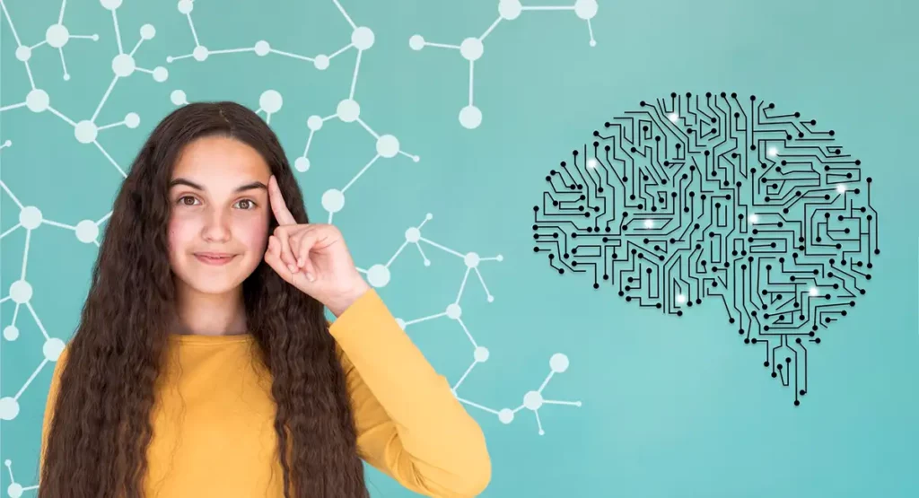 Eine junge Frau schaut in die Kamera, hält sich den Zeigefinger an die Schlefe und deutet damit auf Soft Skills an