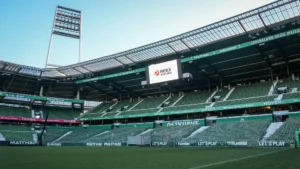 Weserstadion in Bremen mit Rexx Systems Logo auf der Stadionleinwand – Partnerschaft mit SV Werder Bremen
